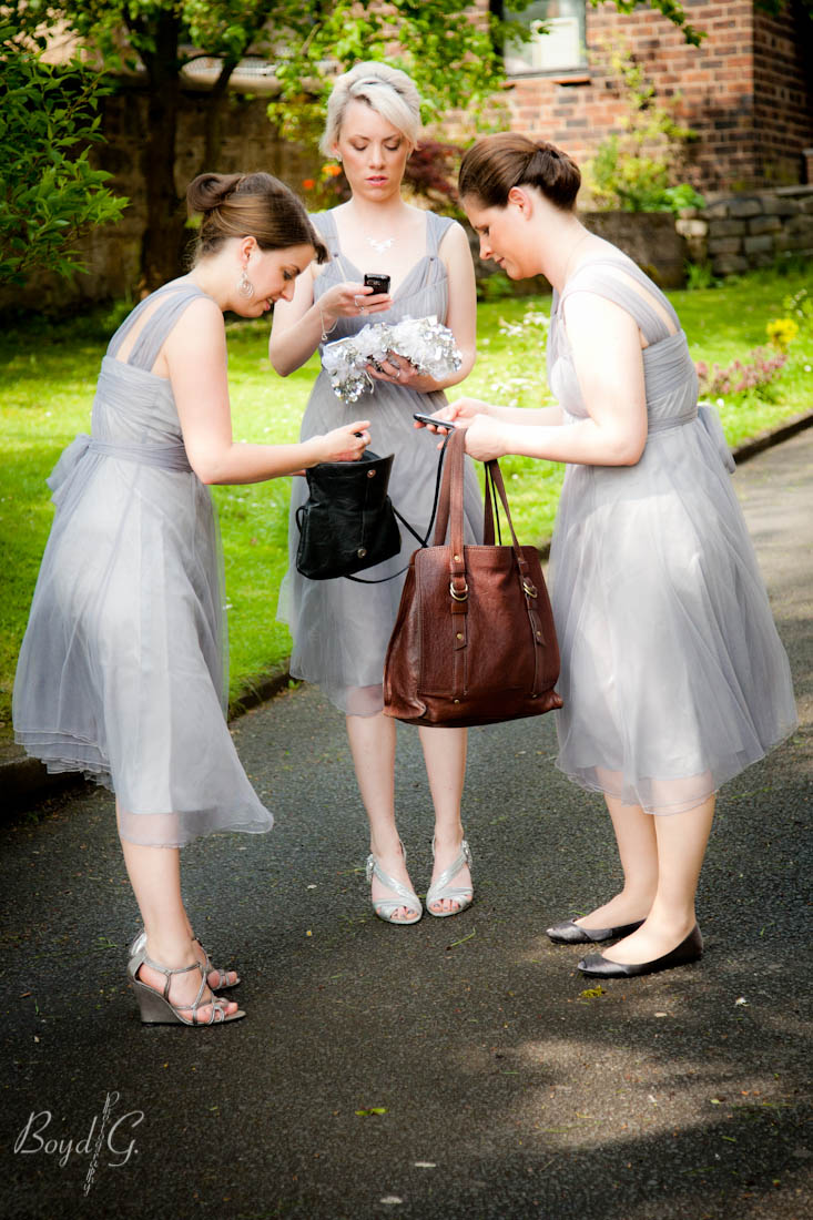 The bridesmaids turning off their cell phones.