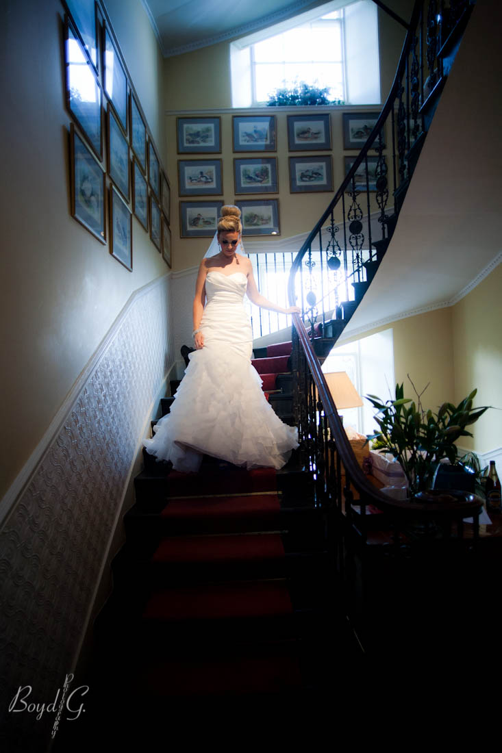 Beautiful bride carefully walking down the stairs